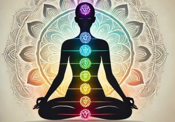 Silhouette meditating with glowing seven chakras aligned along the body..