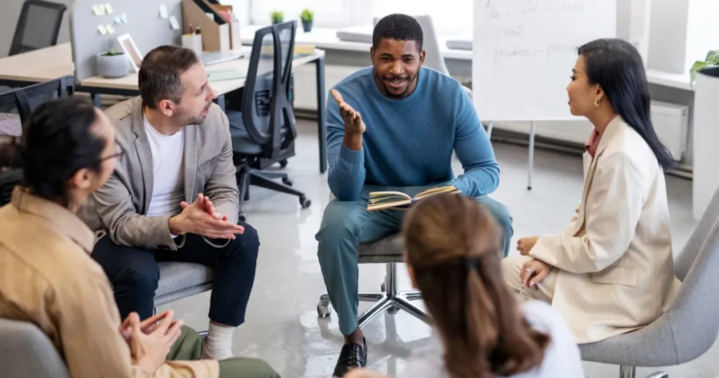 Small group discussion session focused on personal development and mindset growth.