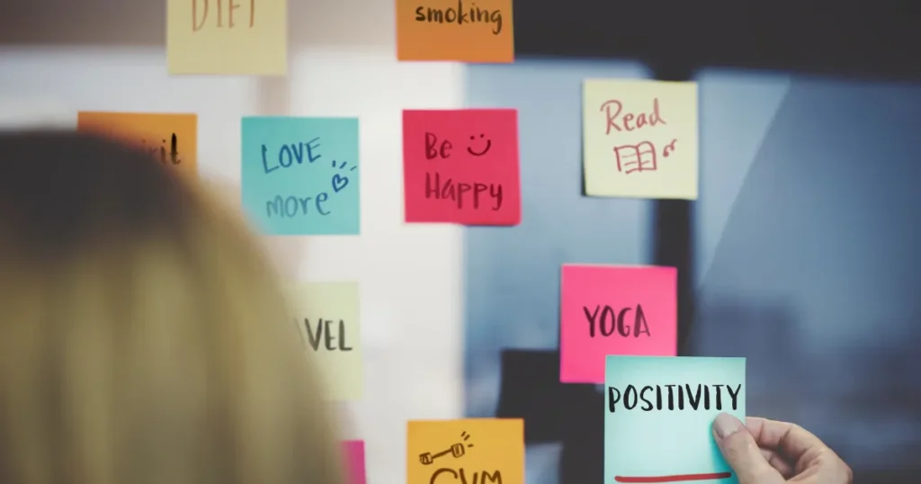 Vision board with positive affirmations and life goals.