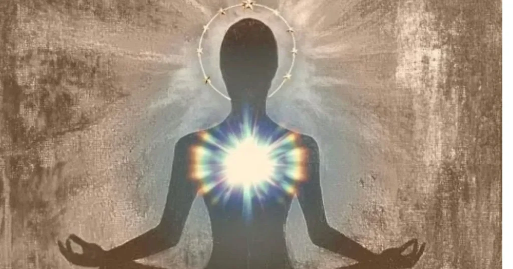 Meditating figure with glowing light at the heart center.